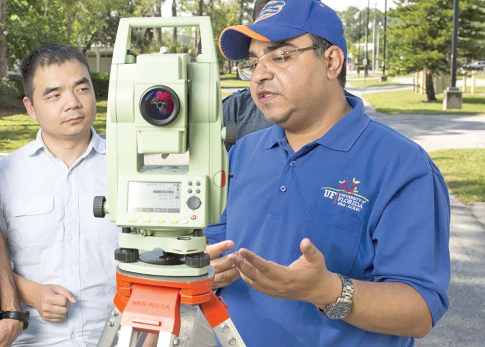 Students work with surveying equipment in a geomatics course at the University of Florida’s Gulf Coast Research and Education Center’s GCREC) Plant City, with Amr Abd-Elrahman, an associate professor of geomatics and principal investigator of the project.